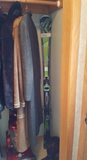 Storing skis in your closet keep them out of the way in temperature controlled condtions.